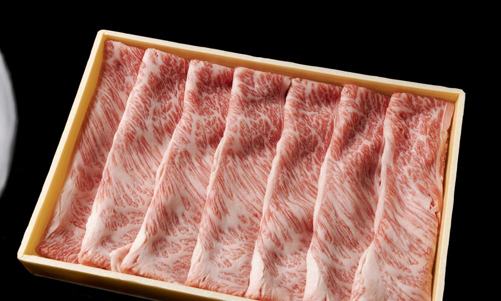Sliced wagyu in a wooden gift box